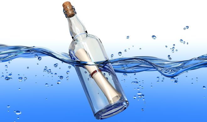 Message in a bottle floating in water